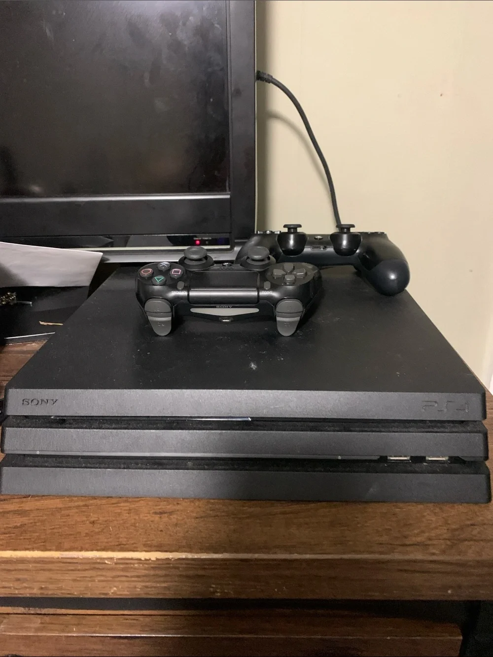 Sony PS4 Pro Matte Black Gaming Console with Two Black Controllers